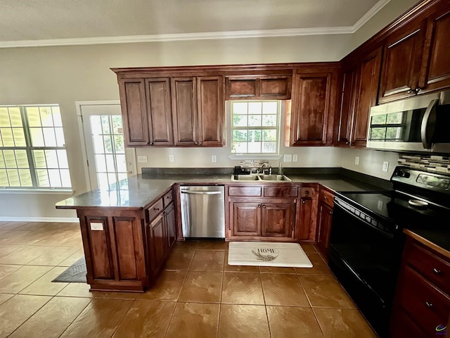 kitchen with sink, stainless steel appliances, crown molding, and dark tile patterned flooring