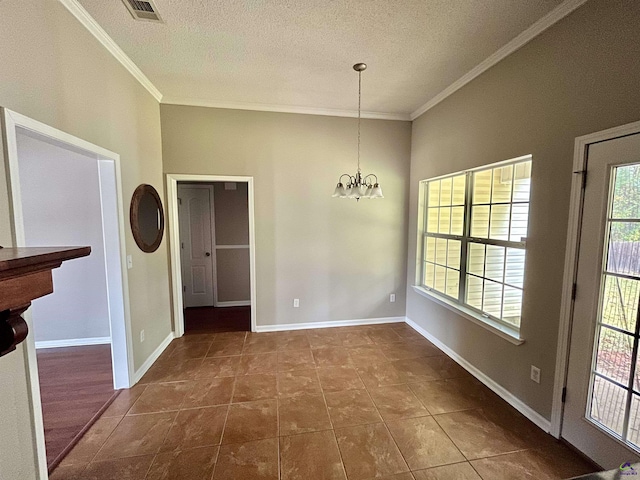 unfurnished dining area featuring dark tile patterned flooring, a textured ceiling, a notable chandelier, and ornamental molding