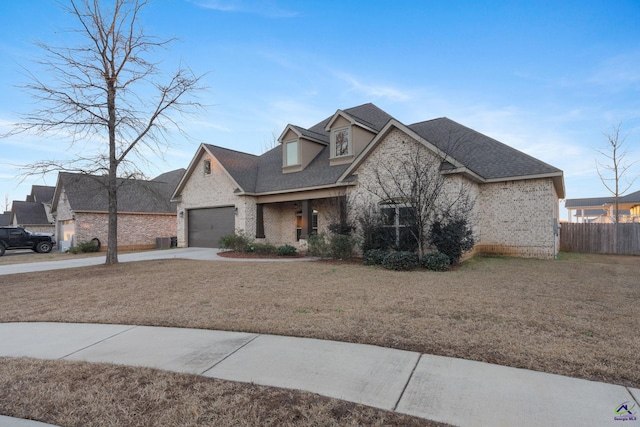 view of front of house with a garage and a front yard