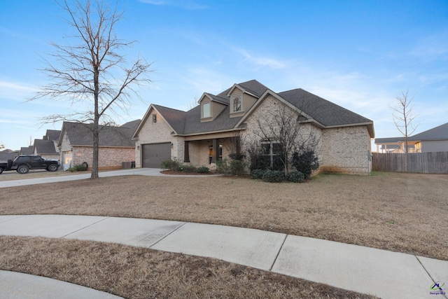 view of front facade with a front yard and a garage