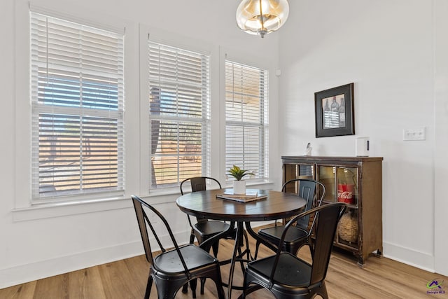 dining area featuring light wood-type flooring