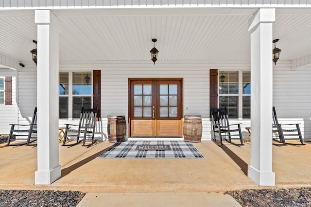 property entrance featuring french doors and a porch