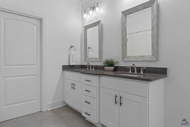 bathroom with tile patterned flooring and vanity