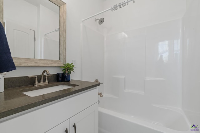 bathroom with vanity and bathing tub / shower combination