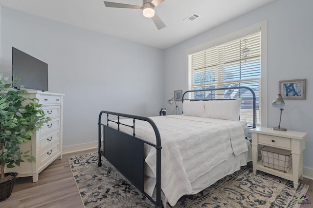 bedroom featuring light hardwood / wood-style floors and ceiling fan