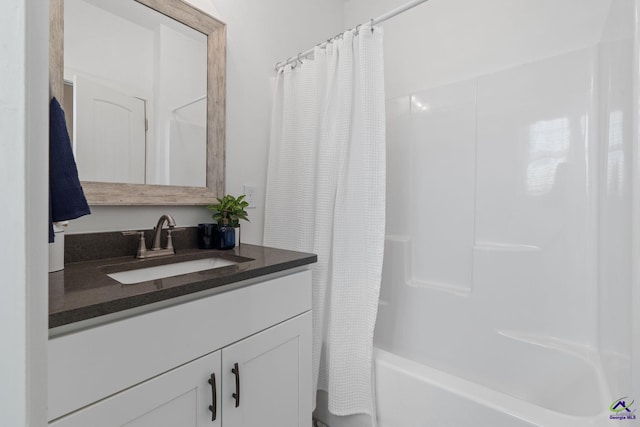 bathroom with shower / bathtub combination with curtain and vanity