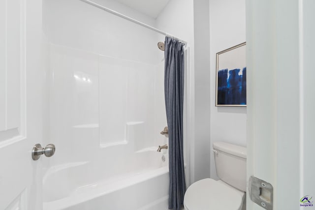 bathroom with toilet and shower / bath combo