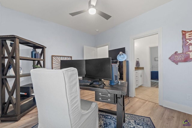 office space with ceiling fan and light hardwood / wood-style floors