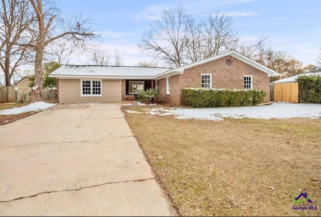 ranch-style house with a front lawn