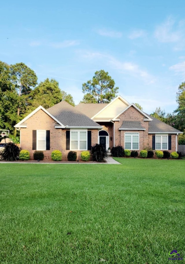 ranch-style home with a front yard