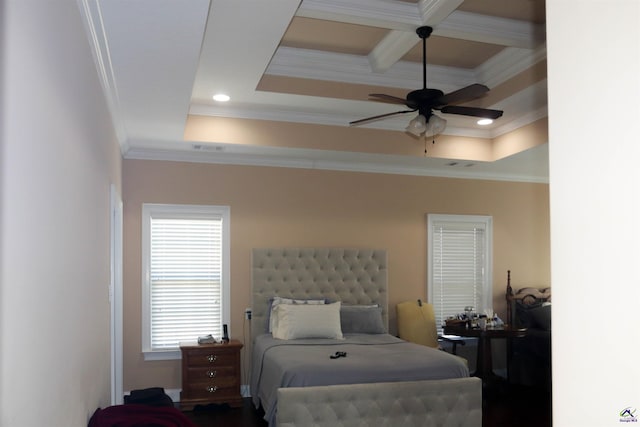 bedroom with a raised ceiling, ornamental molding, coffered ceiling, and beam ceiling