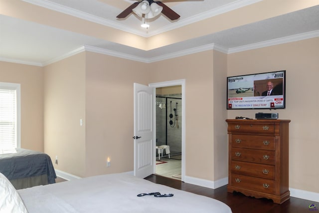 bedroom featuring dark wood-type flooring, ceiling fan, ornamental molding, and connected bathroom