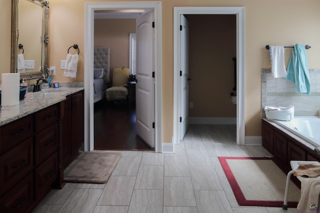 bathroom with vanity and a bathtub