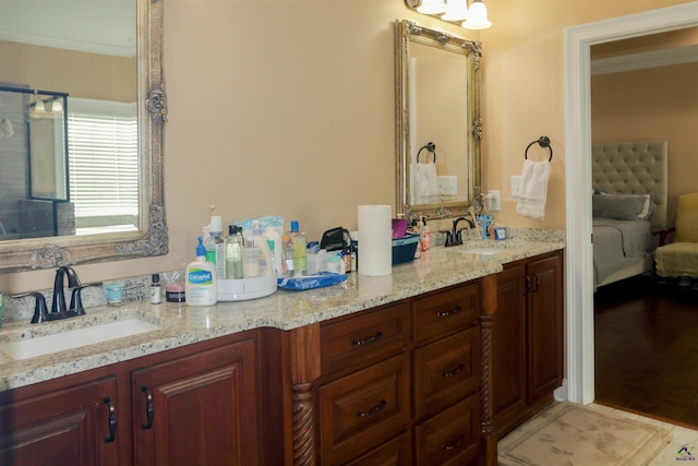 bathroom with vanity, tile patterned floors, and crown molding