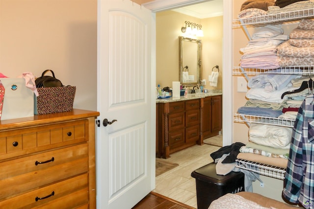 bathroom featuring vanity and crown molding