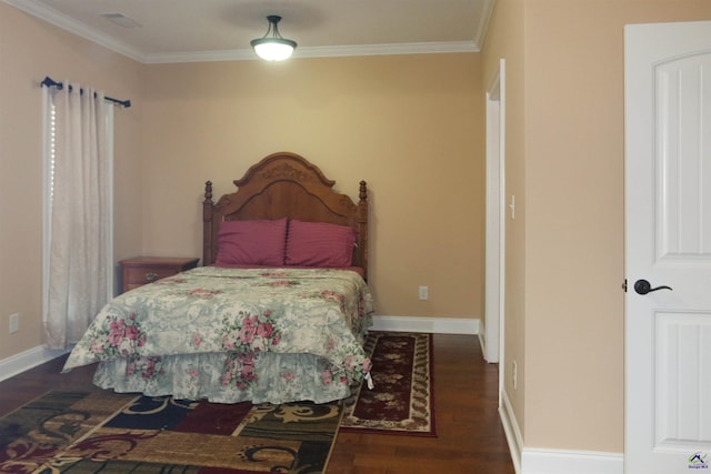 bedroom with crown molding and dark hardwood / wood-style floors