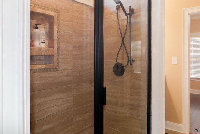 bathroom with a tile shower