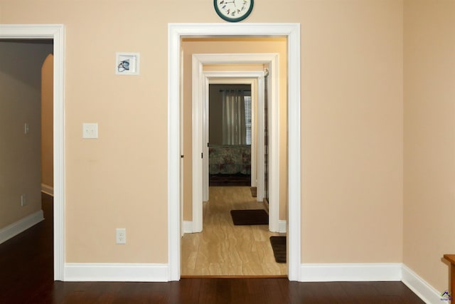 hall featuring dark wood-type flooring