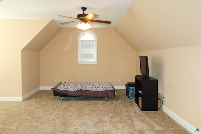 carpeted bedroom with vaulted ceiling and ceiling fan