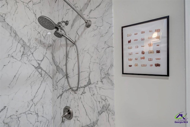 interior details featuring tiled shower