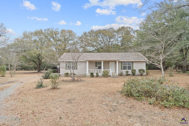 ranch-style house with covered porch