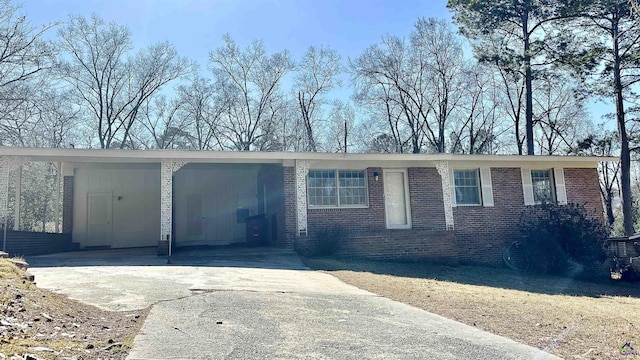 single story home featuring a carport