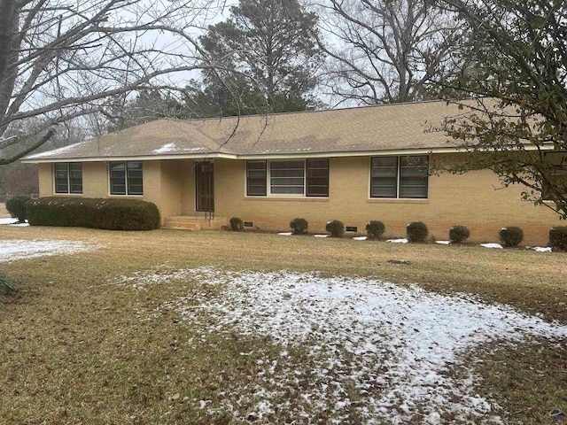 ranch-style house with a lawn