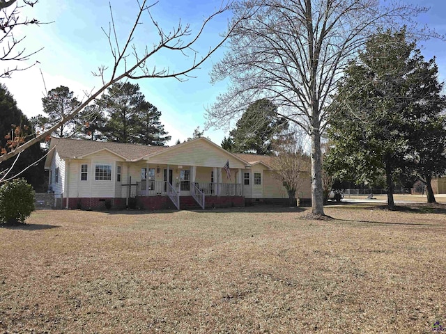 ranch-style home with a porch, crawl space, and a front lawn