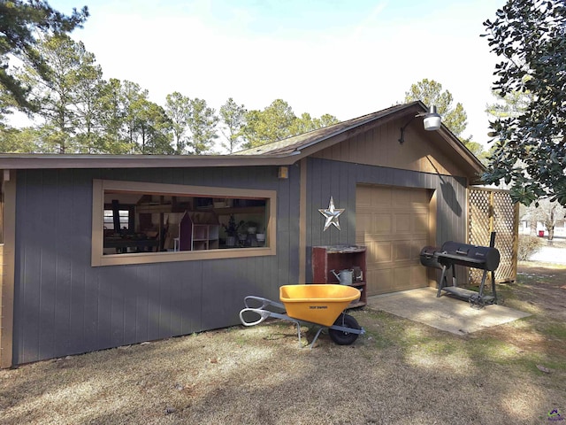 view of side of home with a garage