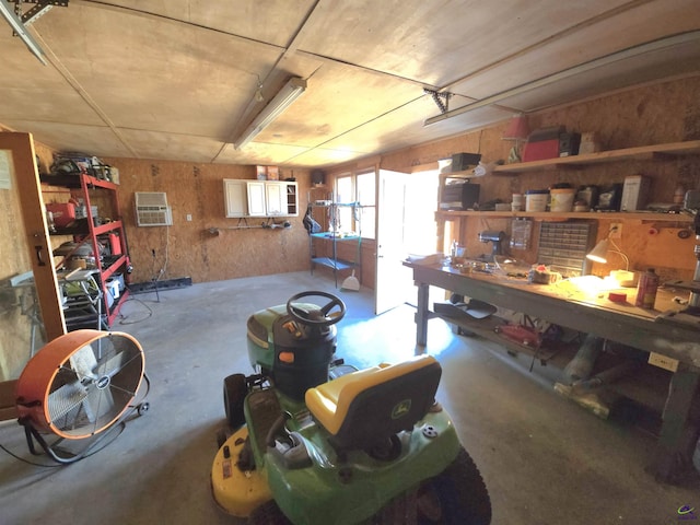 interior space with a garage and a workshop area