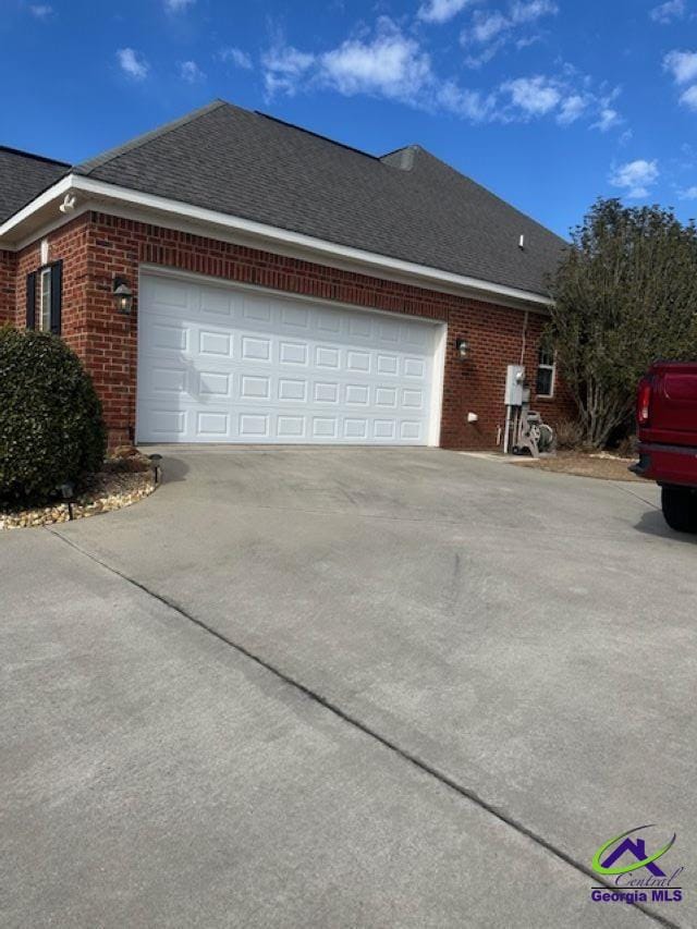 view of property exterior with a garage