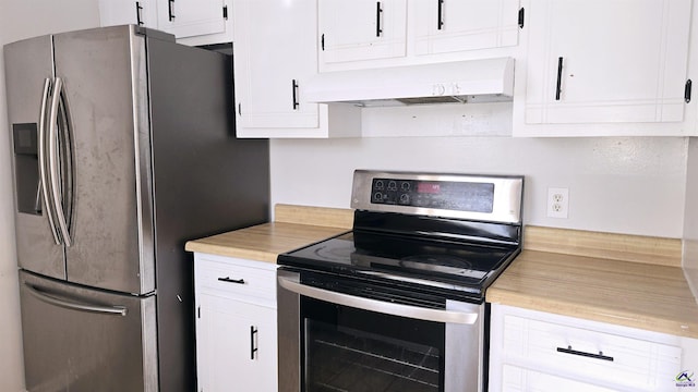 kitchen with white cabinetry, custom exhaust hood, and appliances with stainless steel finishes