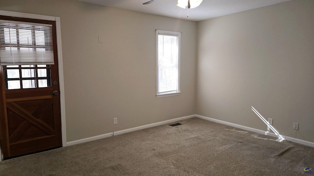 interior space featuring ceiling fan