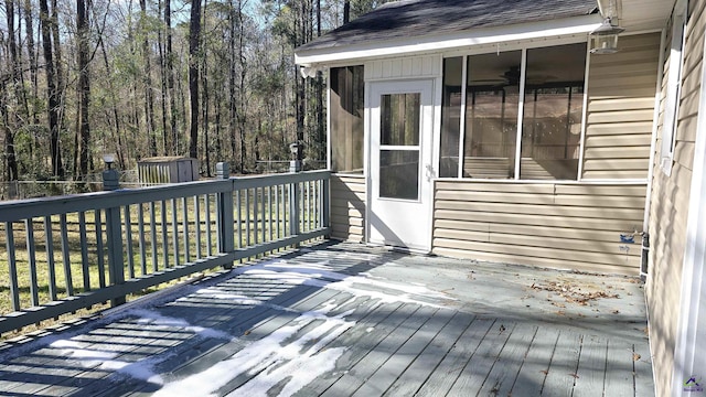 wooden terrace featuring a shed