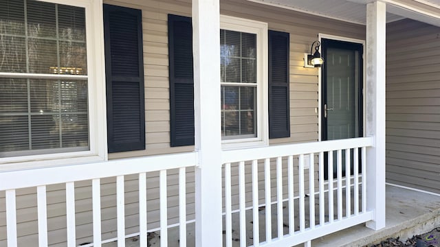 view of exterior entry with a porch