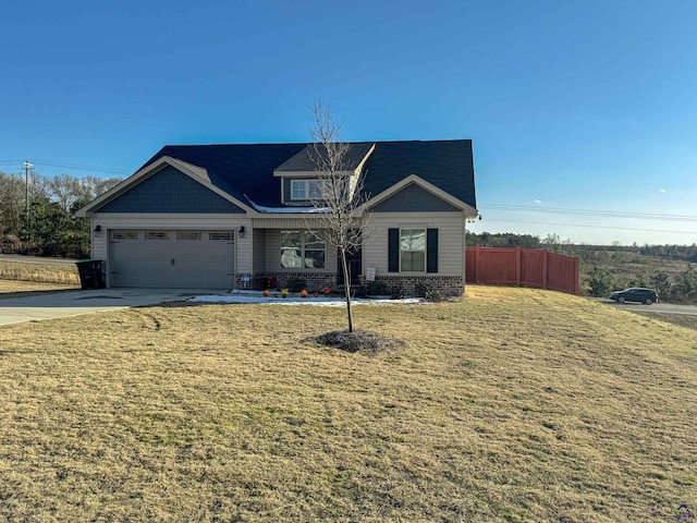 view of front facade with a garage and a front lawn