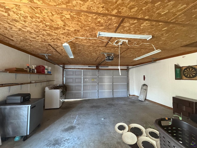 garage with washer / clothes dryer and a garage door opener