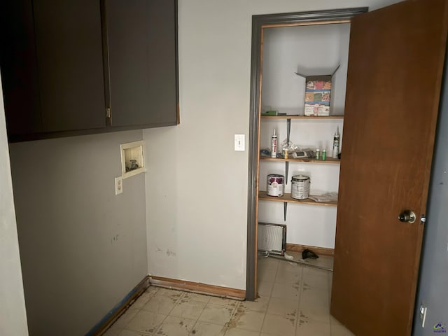 laundry room with cabinets and washer hookup