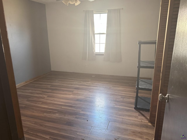 unfurnished room featuring dark hardwood / wood-style flooring