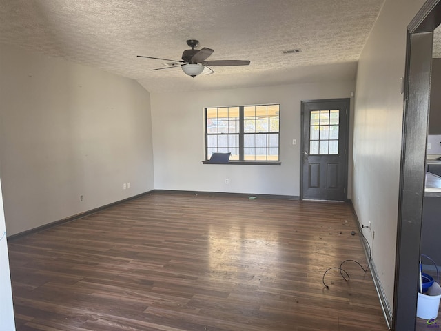 entrance foyer featuring ceiling fan, dark hardwood / wood-style floors, and a textured ceiling