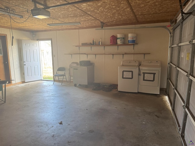 garage featuring a garage door opener and washer and clothes dryer