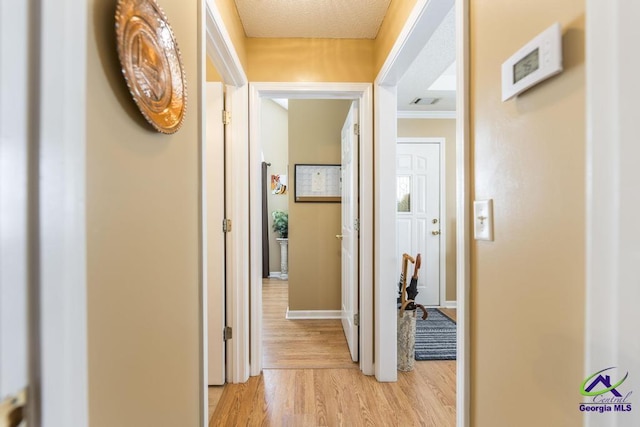 hall with light hardwood / wood-style flooring