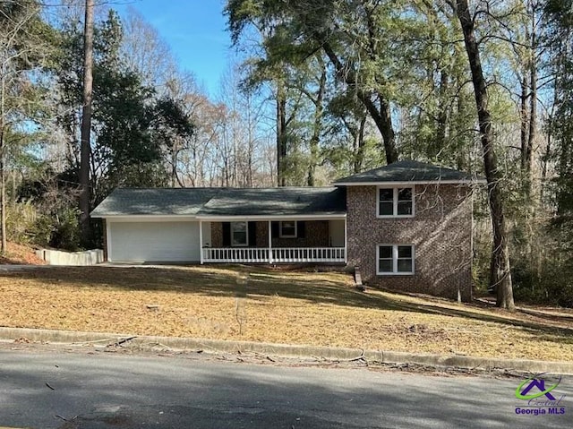 view of front facade with a garage and covered porch