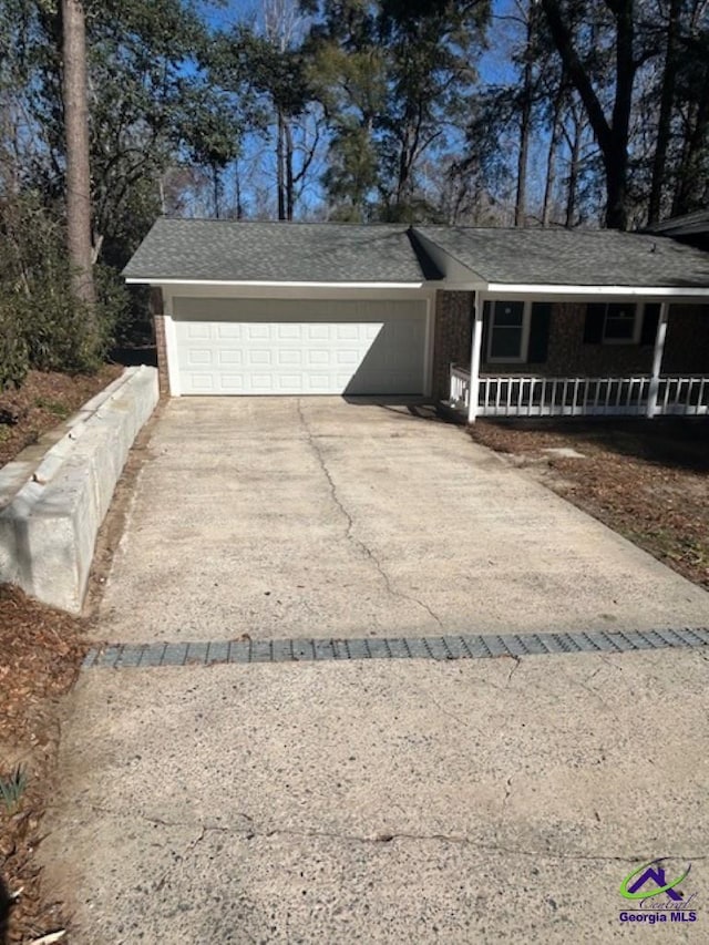 view of front facade featuring a garage and covered porch