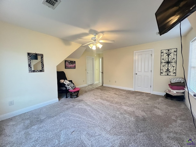 unfurnished room with ceiling fan, carpet flooring, visible vents, and baseboards