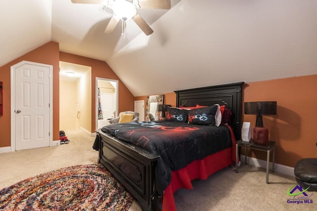 306 Lovorn Cir, Warner Robins, GA 31088 - carpeted bedroom with vaulted ceiling, baseboards, and a ceiling fan