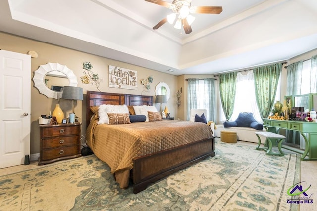 306 Lovorn Cir, Warner Robins, GA 31088 - bedroom with a tray ceiling, carpet floors, and ceiling fan