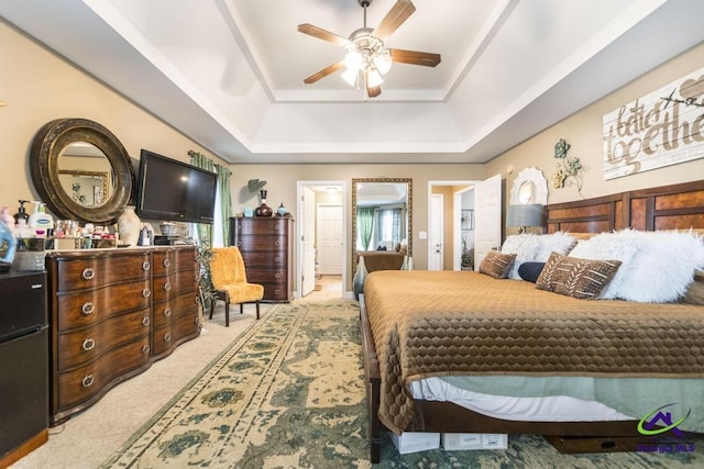 306 Lovorn Cir, Warner Robins, GA 31088 - bedroom featuring a raised ceiling, light colored carpet, and ceiling fan