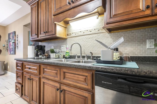306 Lovorn Cir, Warner Robins, GA 31088 - kitchen featuring dishwasher, a sink, dark countertops, and decorative backsplash