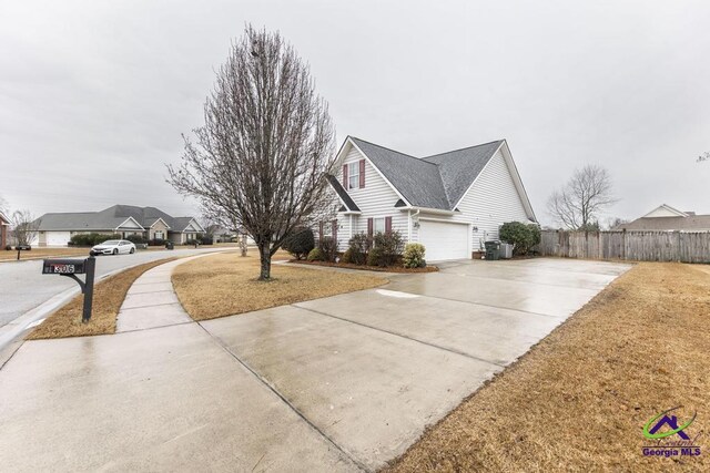 306 Lovorn Cir, Warner Robins, GA 31088 - view of property exterior with driveway and a garage